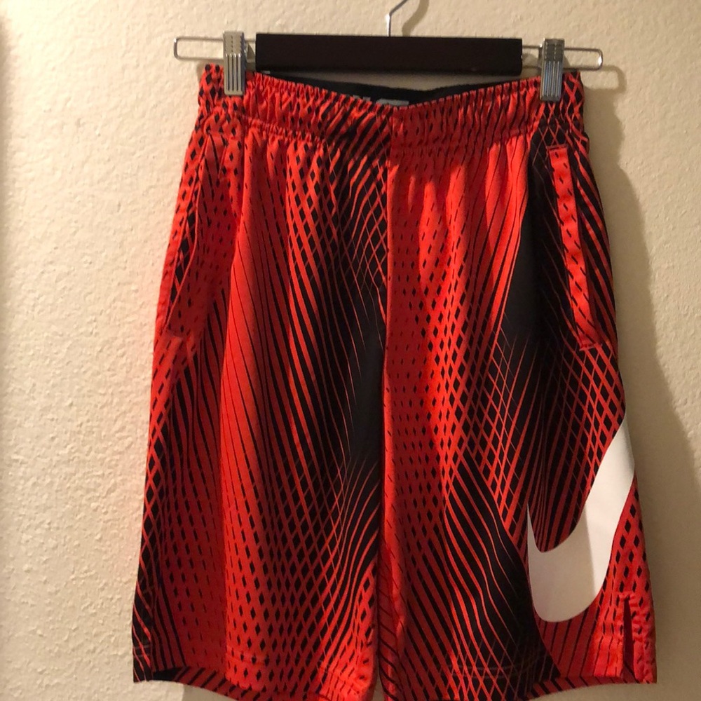 Nike Dri-Fit boy’s shorts size L. Orange.